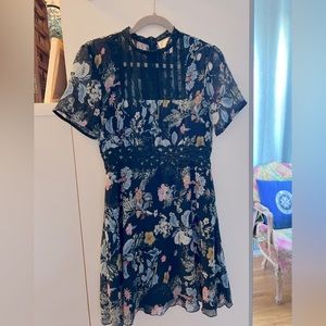 Foxiedox (Anthropologie) short-sleeve dress, size M. Gauzy, sheer, navy floral.